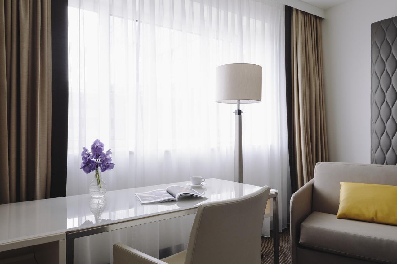 Hotel Pullman Berlin Schweizerhof Esterno foto A room at the hotel